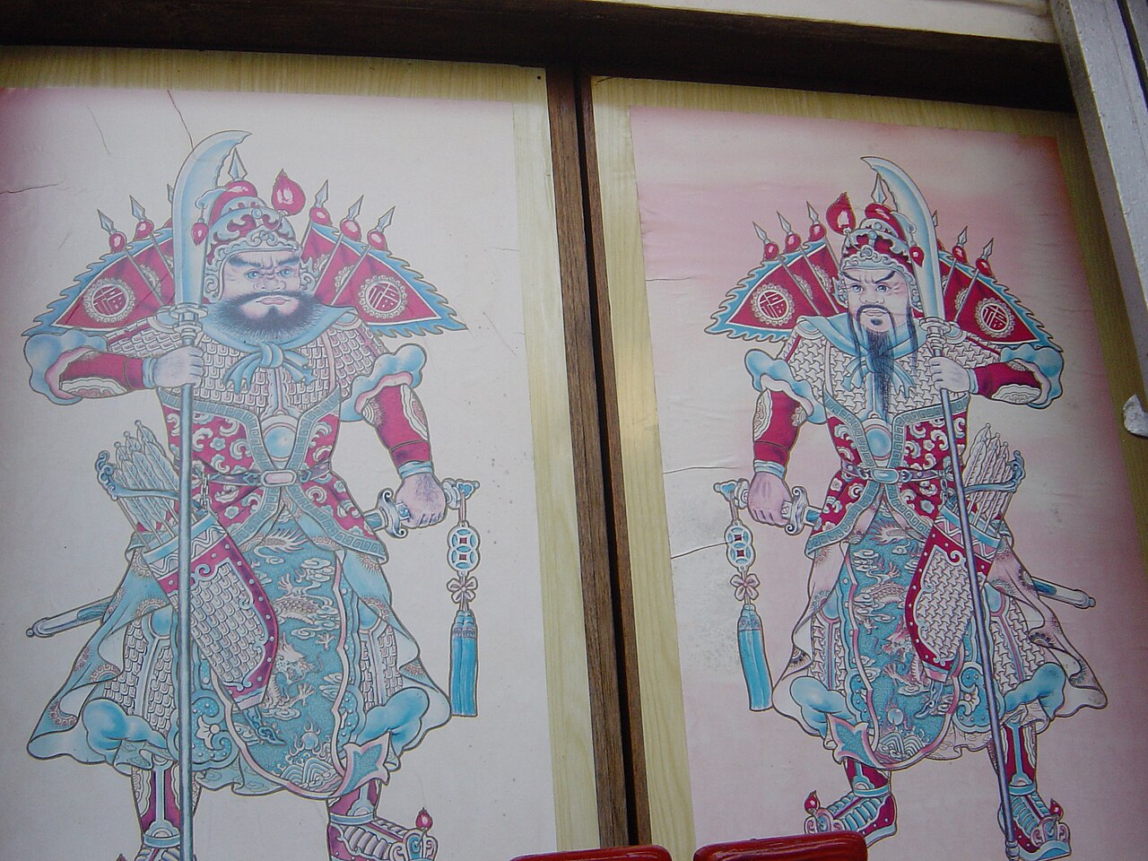 A painted door god guarding a doorway at Chinese New Year