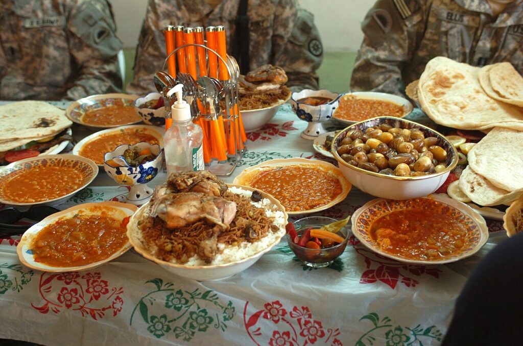 Flickr - The U.S. Army - Soldier and locals share a pre-Ramadan feast