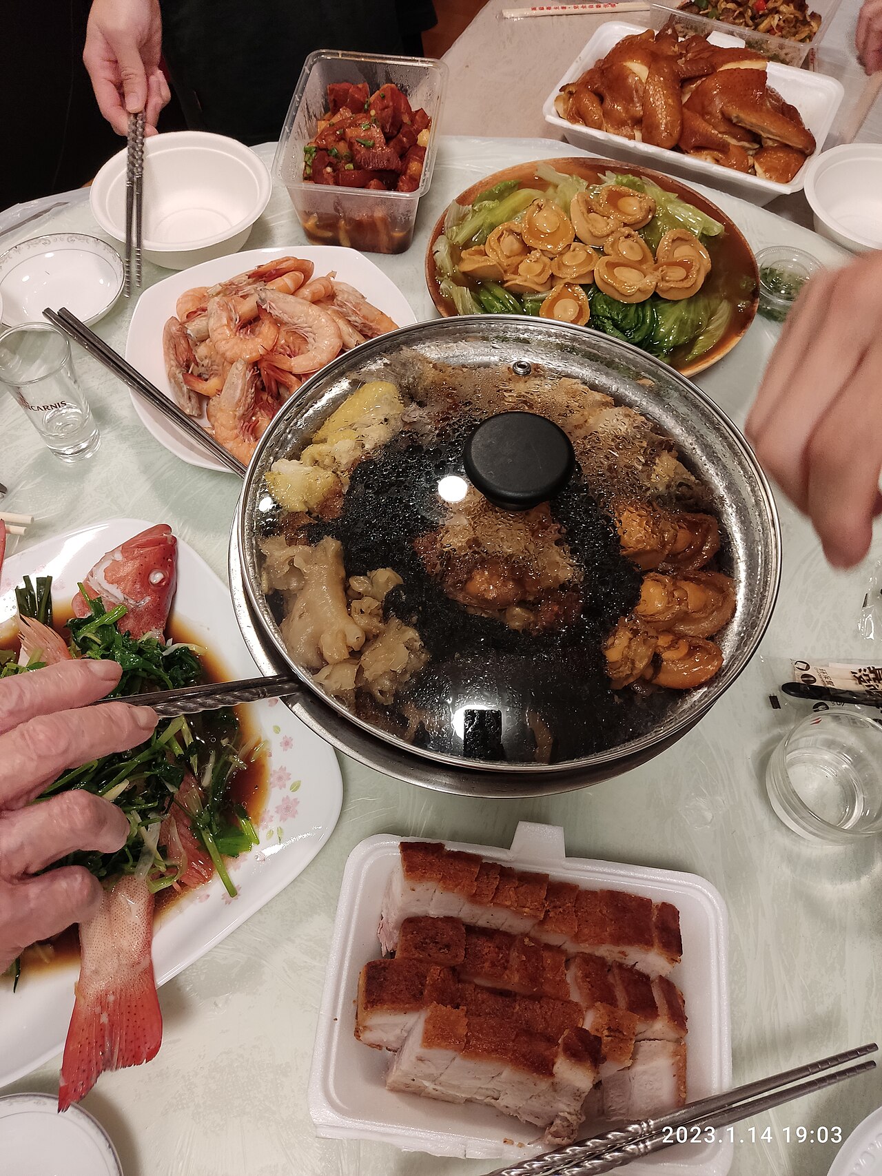 A Chinese New Year reunion dinner laid out on a round table
