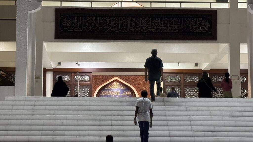 Worshippers performing Taraweeh prayer in a mosque