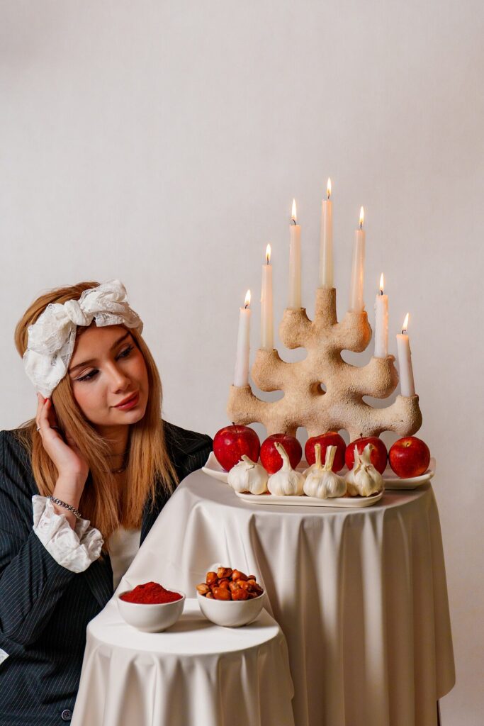 A Female Model Looking at a Haft-Sin Table 2025