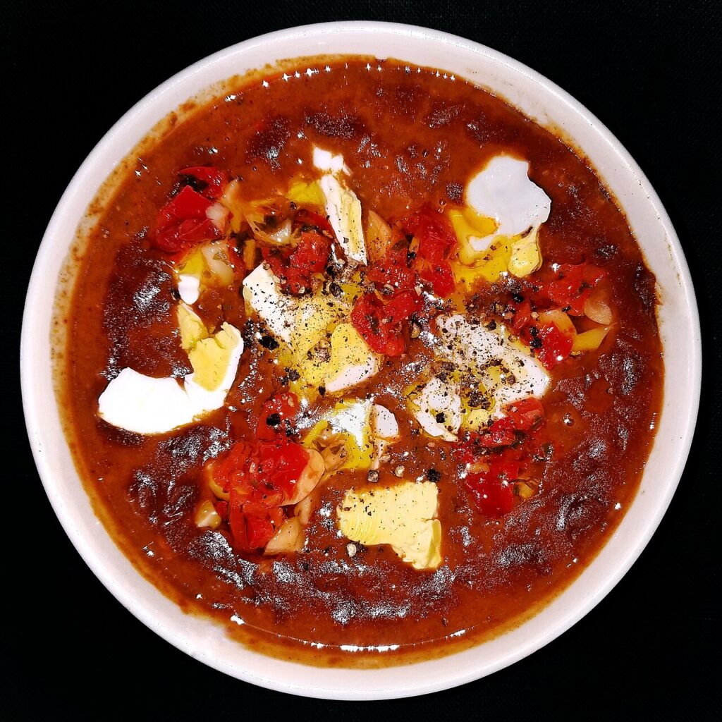 Chili con carne with beef, beans, chili peppers, garlic, black pepper, and a soft-boiled egg - Massachusetts
