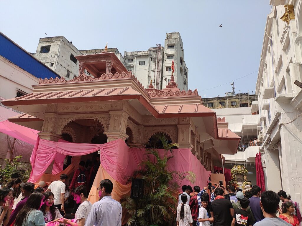 Iconic celebration where a vintage Rolls-Royce, often decorated as a chariot, carries Radha-Krishna idols through the streets 09