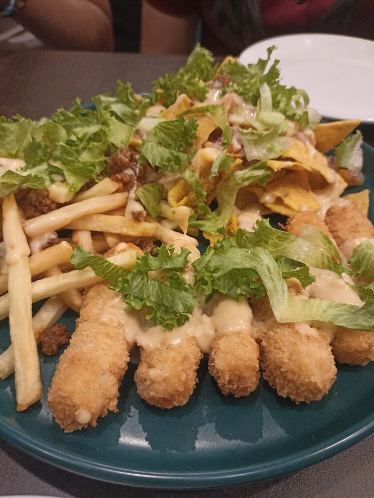 Mozzarella cheese stick, fries, and nachos platter