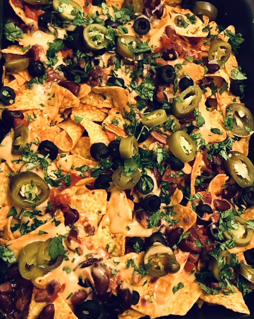Nachos with Melted Cheese, Jalapenos, and Tasty Toppings