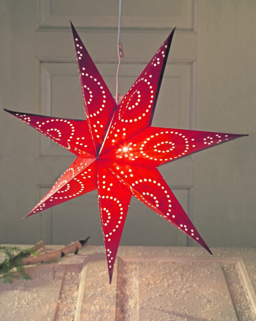 A lit Advent star in a Swedish window