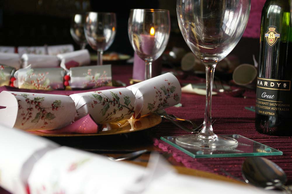 A table laid with Christmas crackers